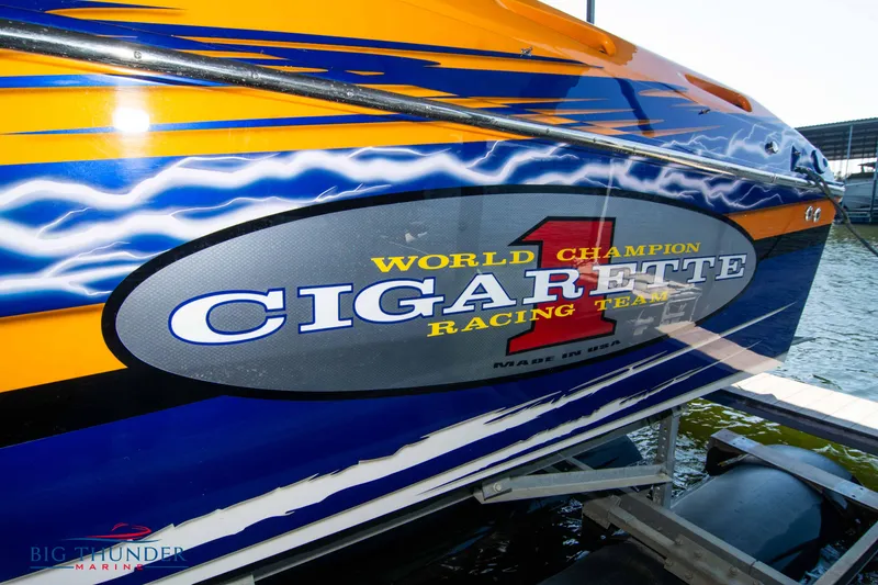 Slide: The Image of 2007 Cigarette 42X boat with vibrant racing team graphics on the side. - 5