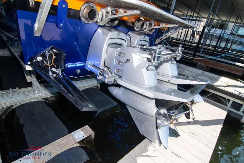 Slide: The Image of 2007 Cigarette 42X boat with powerful dual outboard engines at dock. - 8