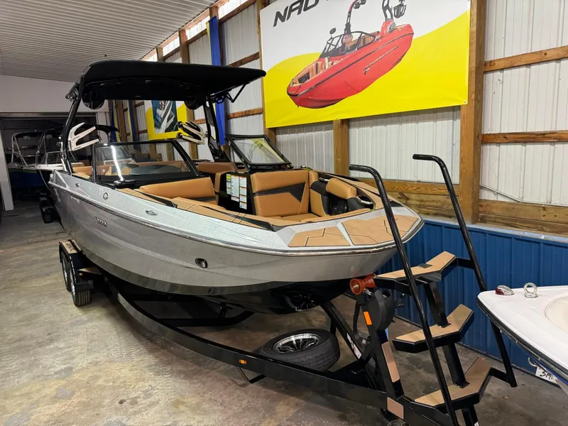 Slide: The Image of 2024 Supreme S240 boat in showroom, featuring sleek design and modern amenities. - 17