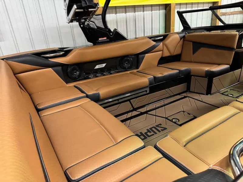 Slide: The Image of 2024 Supreme S240 boat interior with luxurious tan leather seating and modern design. - 20