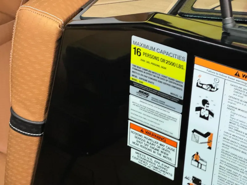 Slide: The Image of 2024 Supreme S240 boat capacity label, seating for 16 people, safety warnings visible. - 25
