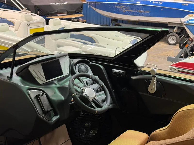 Slide: The Image of 2024 Supreme S240 boat interior with modern dashboard and steering wheel. - 30