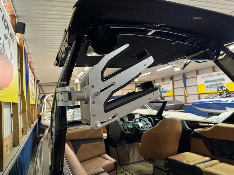 Slide: The Image of 2024 Supreme S240 boat interior with wakeboard rack in showroom. - 33