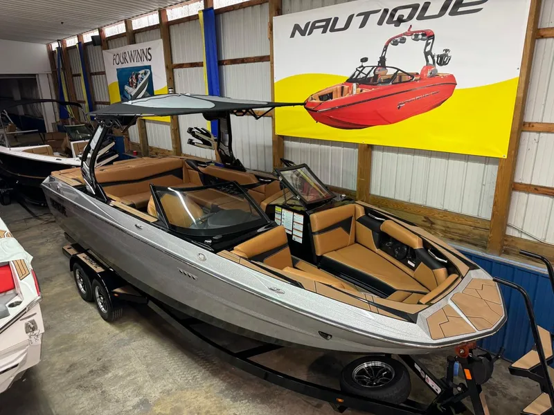 Slide: The Image of 2024 Supreme S240 boat in showroom, featuring sleek design and luxurious interior. - 36