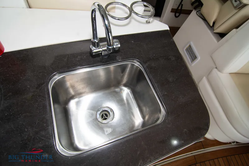 Slide: The Image of Stainless steel sink on 2012 Sea Ray 410 Sundancer yacht with black countertop. - 22