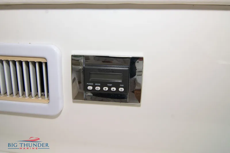 Slide: The Image of Control panel and vent on 2012 Sea Ray 410 Sundancer yacht interior. - 26