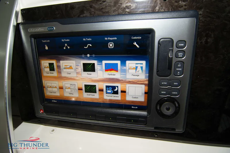 Slide: The Image of Control panel of a 2012 Sea Ray 410 Sundancer boat with navigation display. - 30