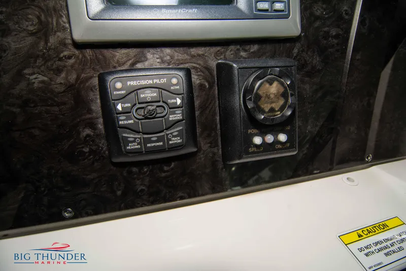 Slide: The Image of Control panel of 2012 Sea Ray 410 Sundancer boat with precision pilot system. - 36