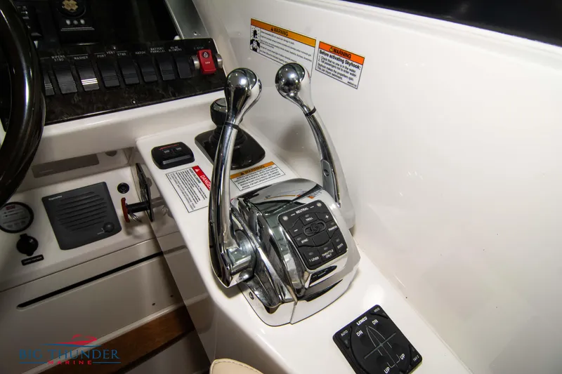 Slide: The Image of Close-up of 2012 Sea Ray 410 Sundancer boat controls and throttle levers. - 39