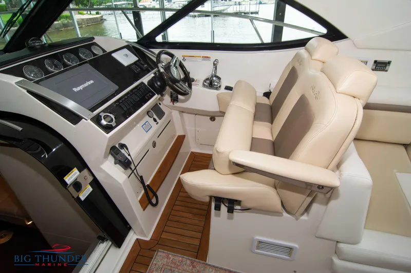 Slide: The Image of Interior helm of 2012 Sea Ray 410 Sundancer with leather seats and modern controls. - 41