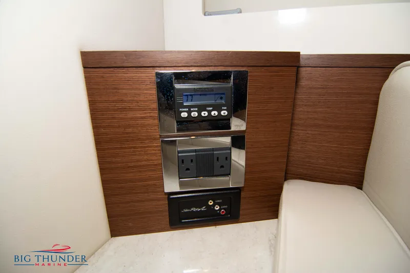 Slide: The Image of Control panel on 2012 Sea Ray 410 Sundancer yacht interior with outlets and audio system. - 47