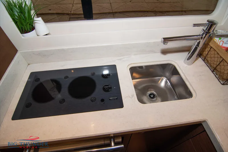 Slide: The Image of Modern kitchen area in 2012 Sea Ray 410 Sundancer yacht with stove and sink. - 49