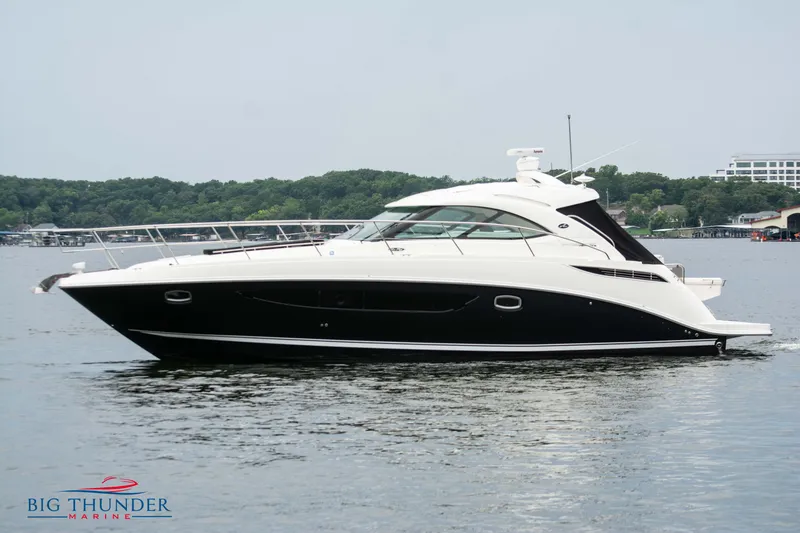 Slide: The Image of 2012 Sea Ray 410 Sundancer yacht on calm water, side view. - 6