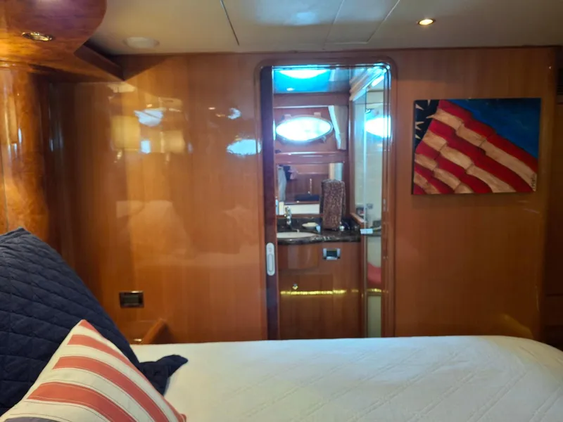 Slide: The Image of Luxurious cabin interior of 2004 Ocean Alexander 64 Pilothouse yacht with wooden finish. - 16