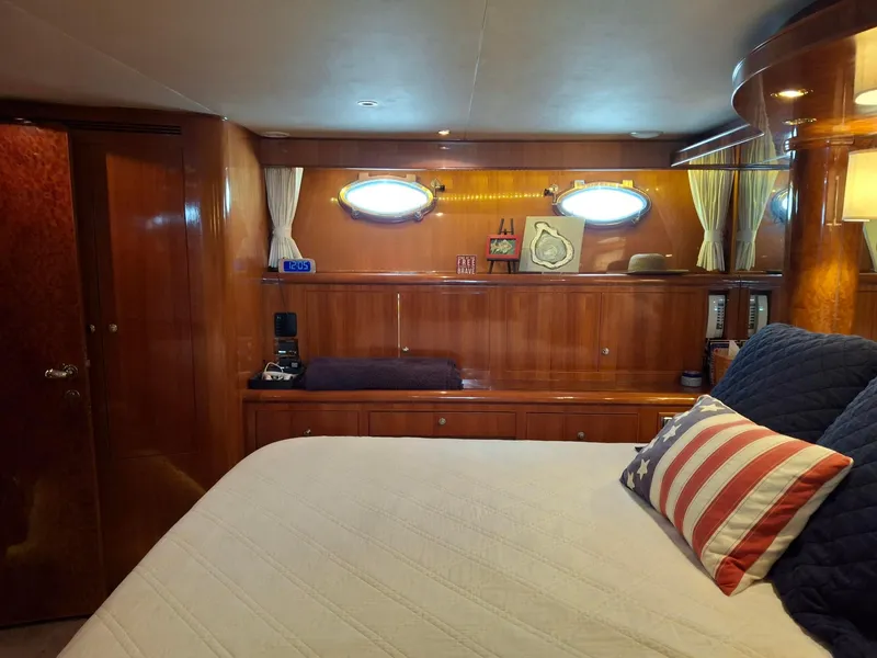 Slide: The Image of Luxurious cabin interior of 2004 Ocean Alexander 64 Pilothouse yacht with elegant wood finish. - 17