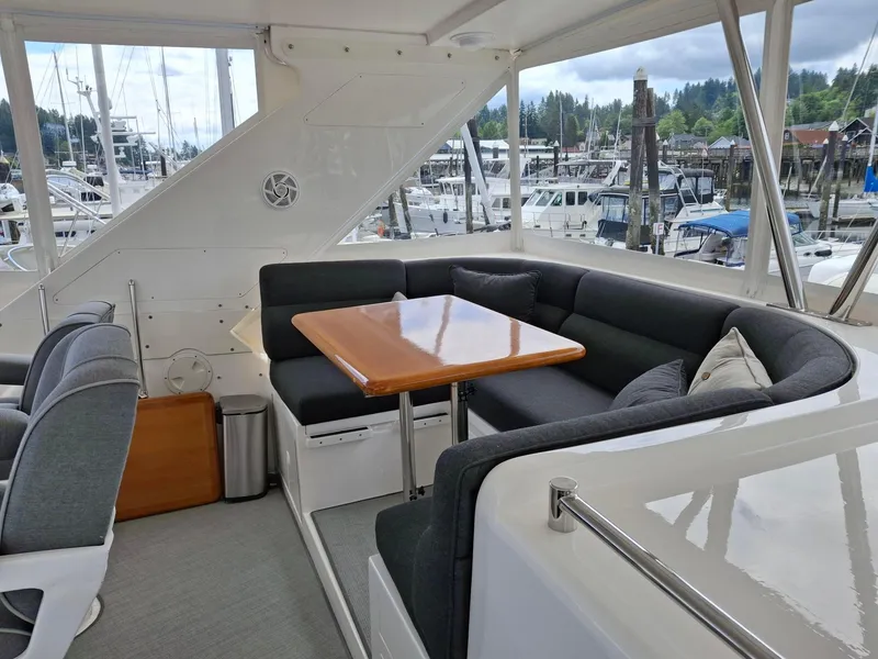 Slide: The Image of Luxurious seating area on a 2004 Ocean Alexander 64 Pilothouse yacht. - 27