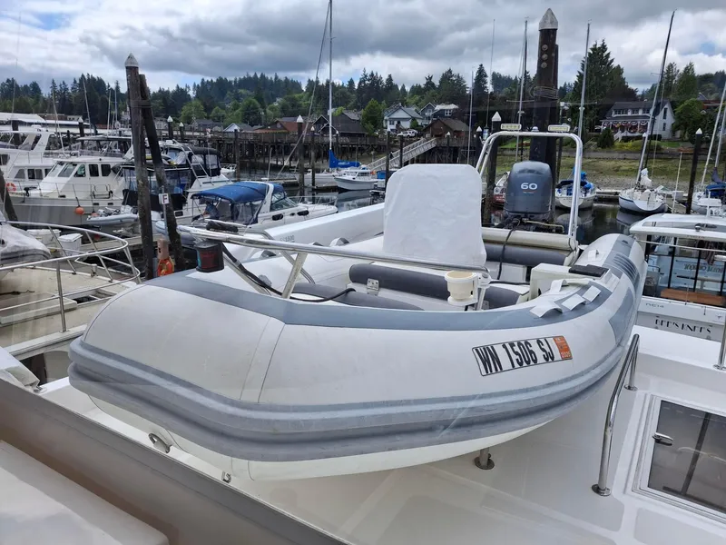 Slide: The Image of Inflatable boat on Ocean Alexander 64 Pilothouse, 2004 model, docked at marina. - 30