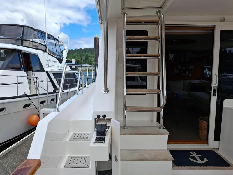 Slide: The Image of 2004 Ocean Alexander 64 Pilothouse yacht with ladder and deck view. - 31