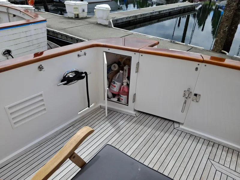 Slide: The Image of Deck view of 2004 Ocean Alexander 64 Pilothouse with open storage compartment. - 36