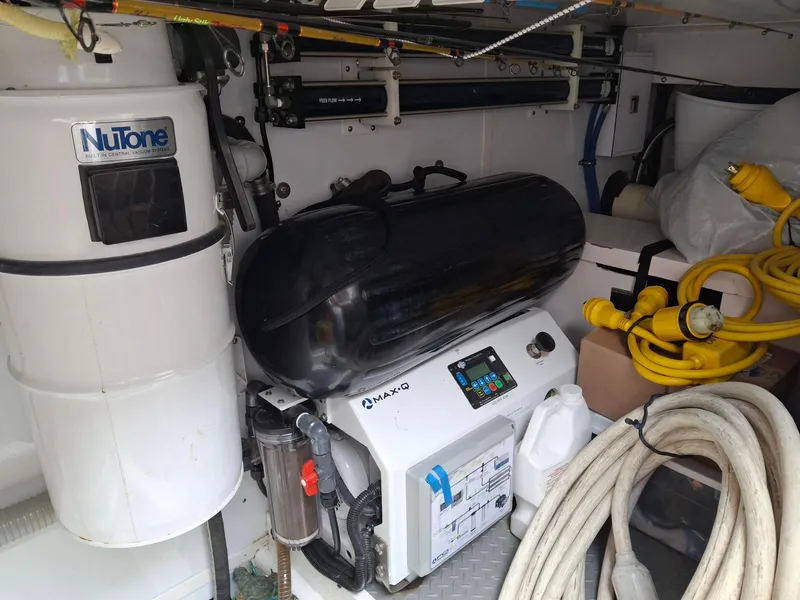 Slide: The Image of Engine room of 2004 Ocean Alexander 64 Pilothouse with equipment and cables. - 38