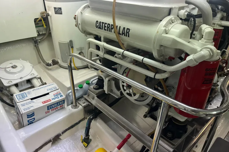 Slide: The Image of Engine room of 2004 Ocean Alexander 64 Pilothouse with Caterpillar engine and maintenance supplies. - 40