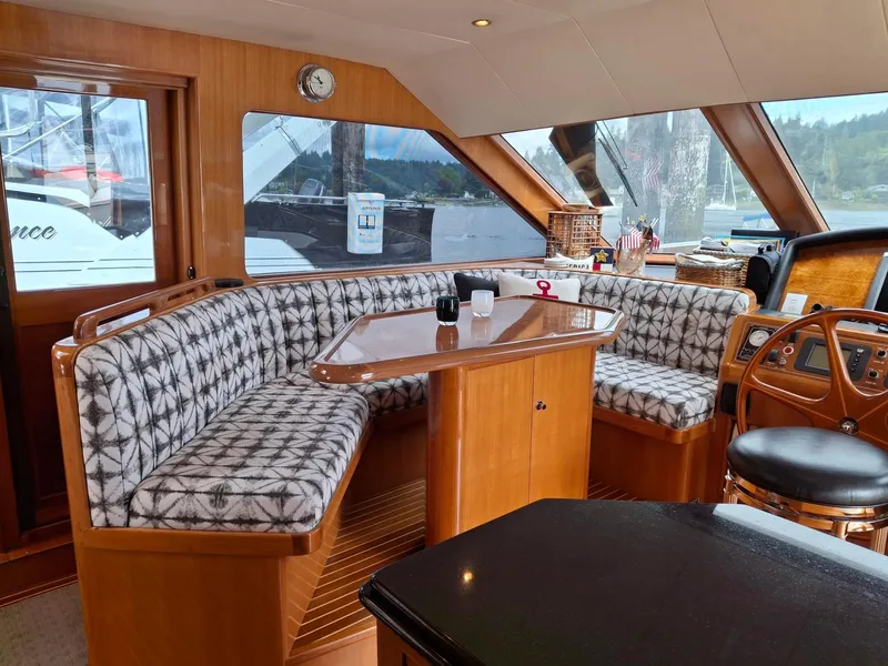 Slide: The Image of Luxurious interior of 2004 Ocean Alexander 64 Pilothouse yacht with elegant seating and helm. - 7