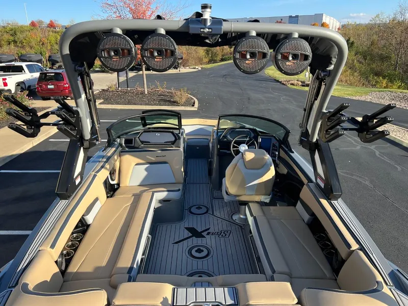 Slide: The Image of 2024 MasterCraft XStar S boat interior with premium seating and advanced sound system. - 22