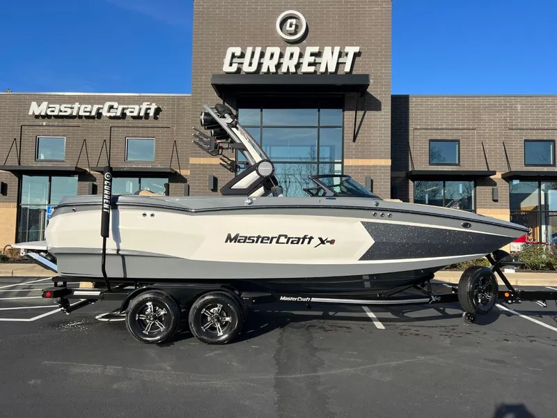 Slide: The Image of 2024 MasterCraft XStar S boat parked outside dealership. - 3