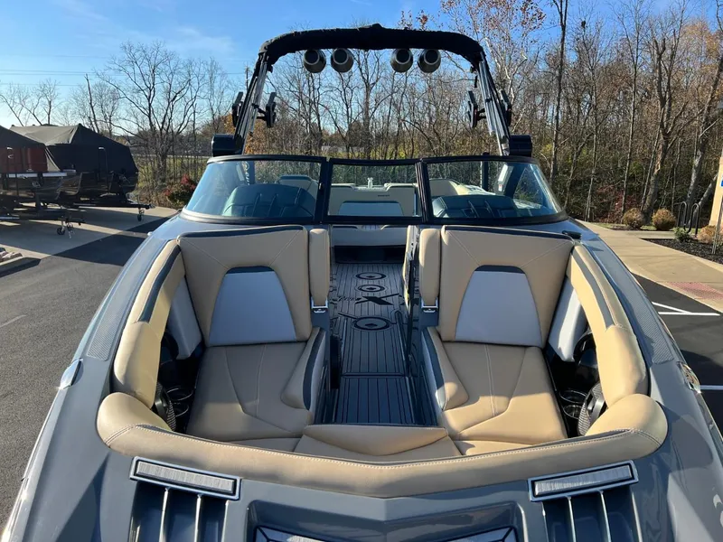 Slide: The Image of 2024 MasterCraft XStar S boat with luxurious seating and sleek design. - 7