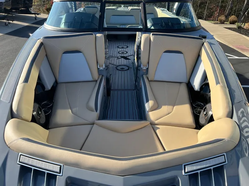 Slide: The Image of 2024 MasterCraft XStar S boat interior with tan leather seating and modern design. - 8