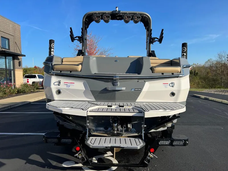 Slide: The Image of 2024 MasterCraft XStar S boat rear view in parking lot. - 9