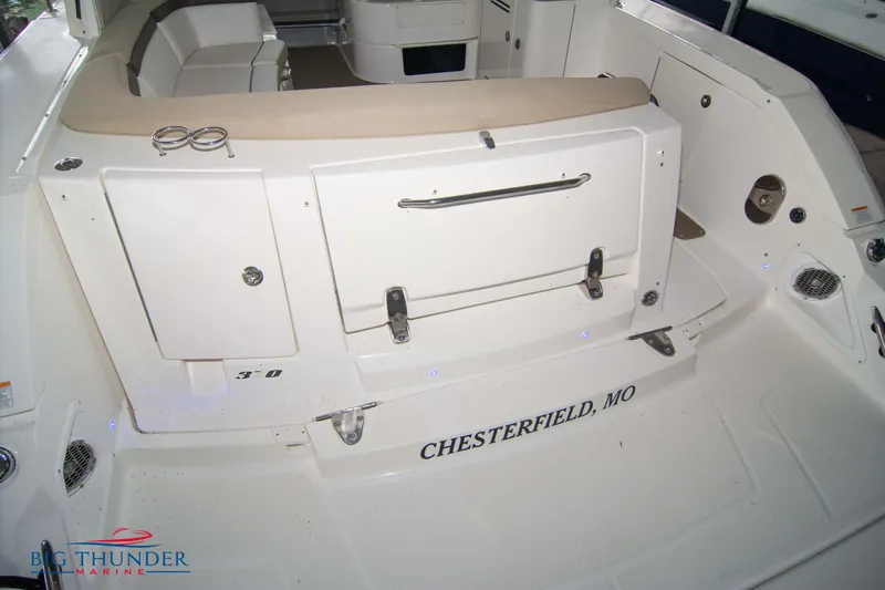 Slide: The Image of 2016 Sea Ray 370 Sundancer boat interior, featuring seating and storage, Chesterfield, MO. - 10