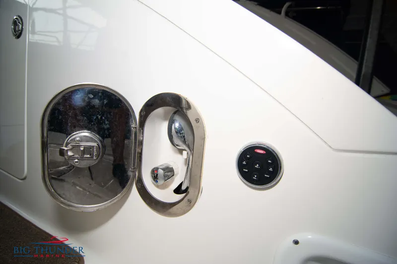 Slide: The Image of 2016 Sea Ray 370 Sundancer fuel cap and control panel detail. - 13