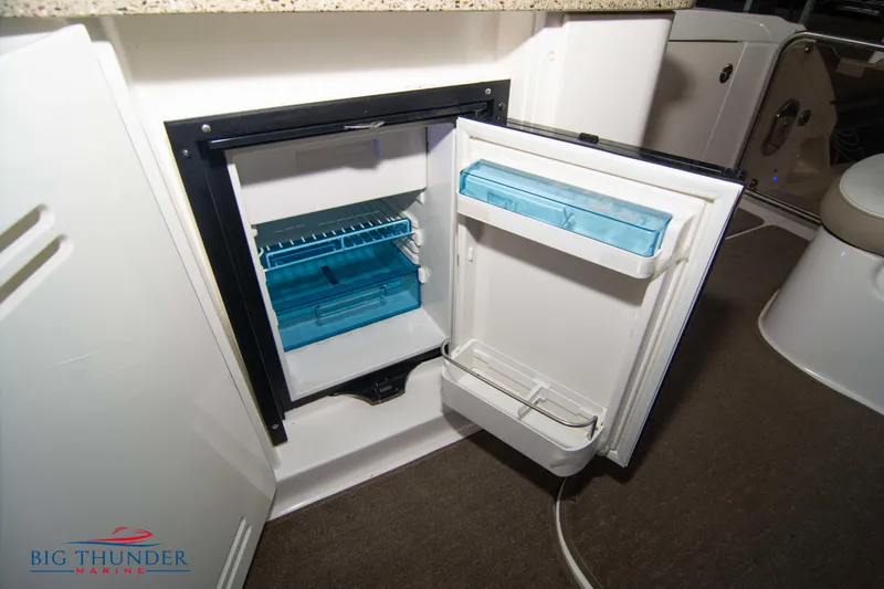 Slide: The Image of Open mini fridge inside 2016 Sea Ray 370 Sundancer boat cabin. - 19