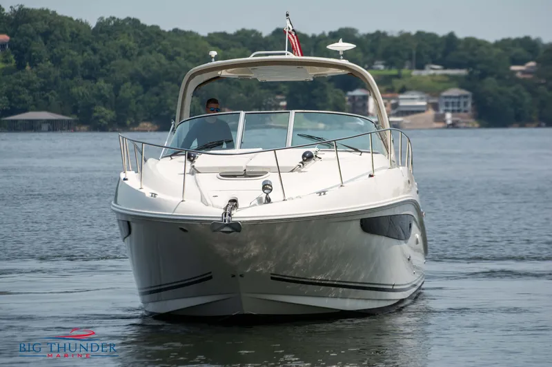 Slide: The Image of 2016 Sea Ray 370 Sundancer yacht cruising on a serene lake. - 3