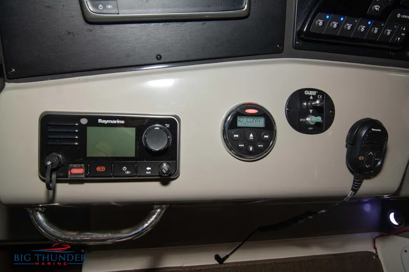 Slide: The Image of Control panel of 2016 Sea Ray 370 Sundancer with Raymarine radio and gauges. - 30
