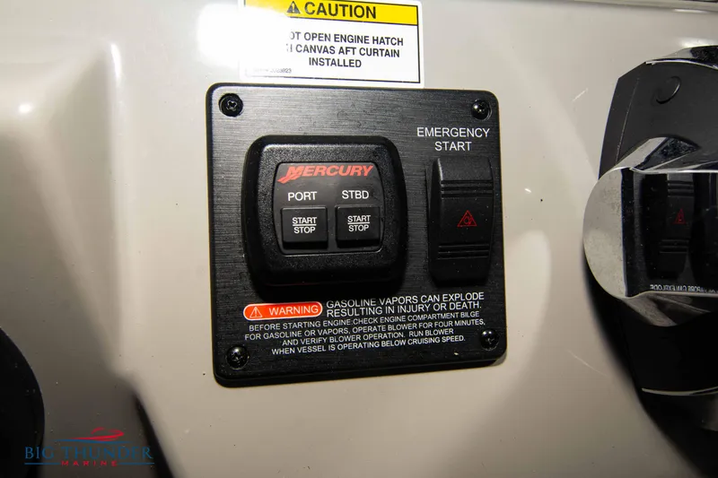 Slide: The Image of Control panel of a 2016 Sea Ray 370 Sundancer with Mercury start buttons. - 32