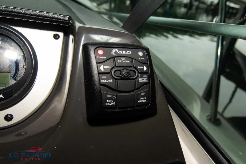 Slide: The Image of Control panel of 2016 Sea Ray 370 Sundancer boat with various navigation buttons. - 33