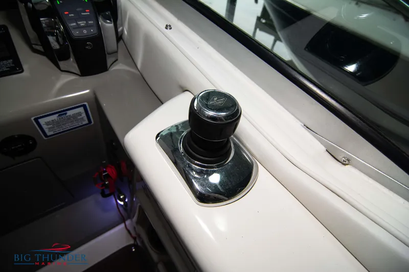 Slide: The Image of 2016 Sea Ray 370 Sundancer boat control panel with joystick. - 34