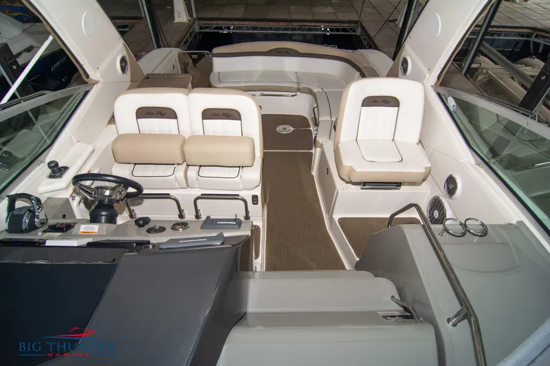 Slide: The Image of 2016 Sea Ray 370 Sundancer interior with plush seating and modern helm controls. - 41