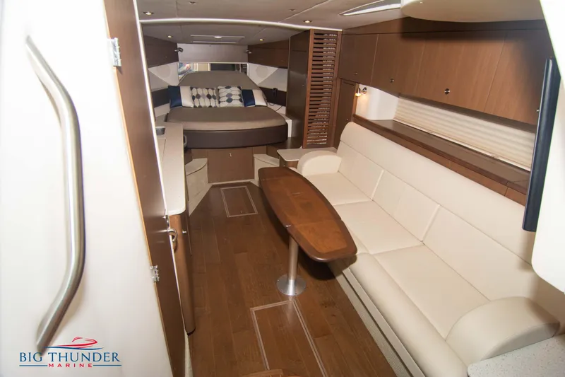 Slide: The Image of Luxurious interior of 2016 Sea Ray 370 Sundancer yacht with elegant seating and wood finishes. - 48