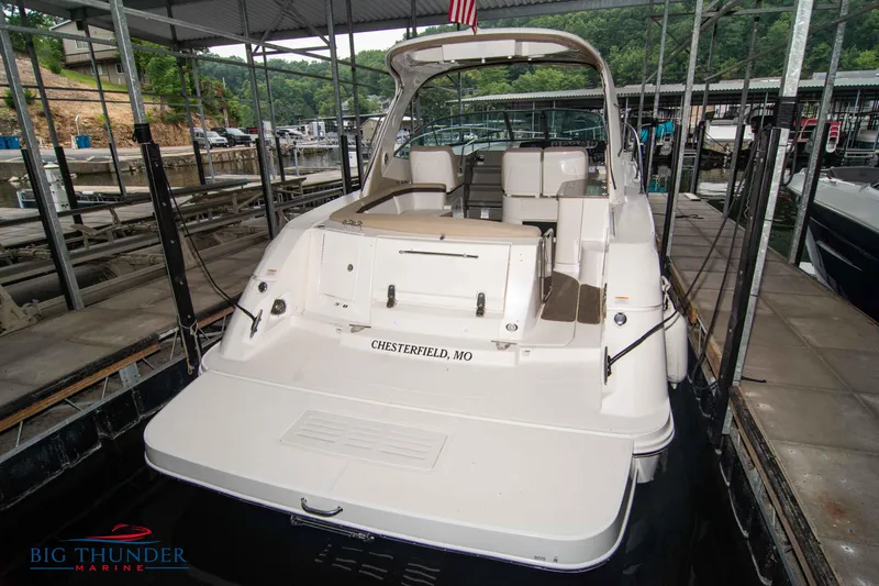 Slide: The Image of 2016 Sea Ray 370 Sundancer docked at marina, rear view. - 9