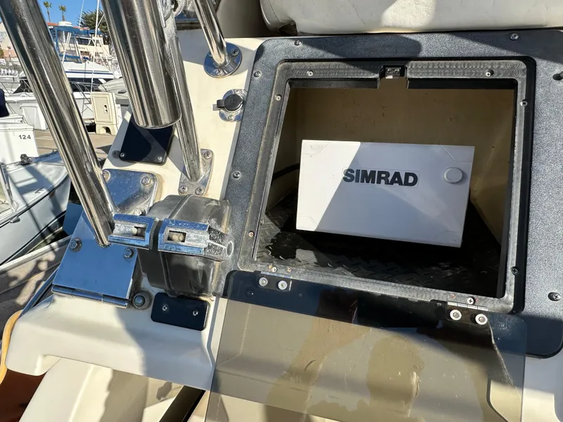 Slide: The Image of Simrad navigation system on 1994 Precision 28 Convertible boat dashboard. - 10