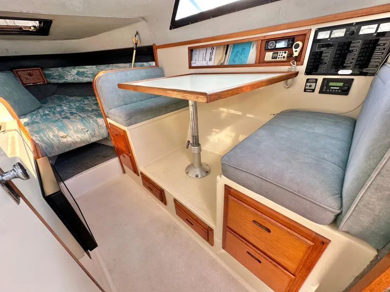 Slide: The Image of Interior of 1994 Precision 28 Convertible boat with seating and table. - 18