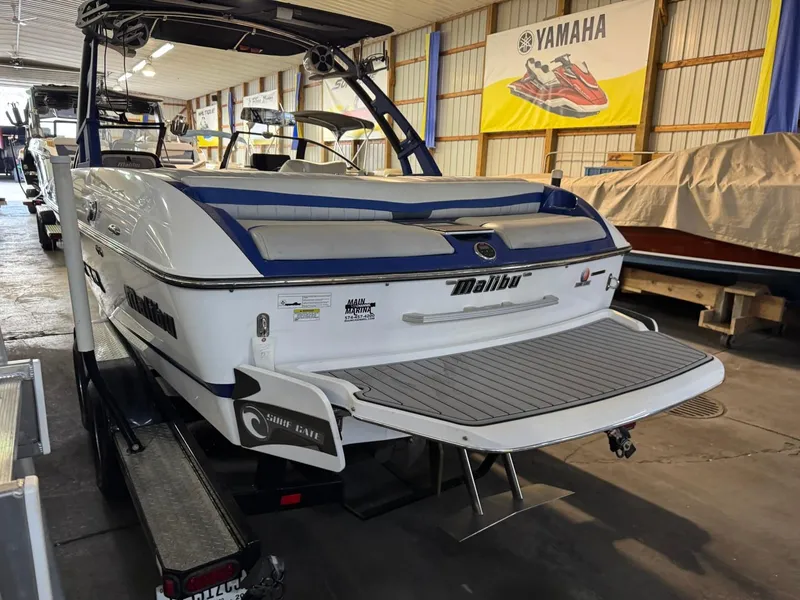 Slide: The Image of 2015 Malibu Wakesetter 22 MXZ boat in indoor storage facility. - 16