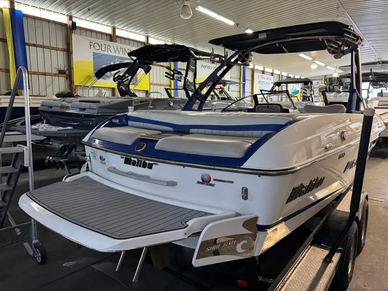 Slide: The Image of 2015 Malibu Wakesetter 22 MXZ boat in showroom, rear view. - 17
