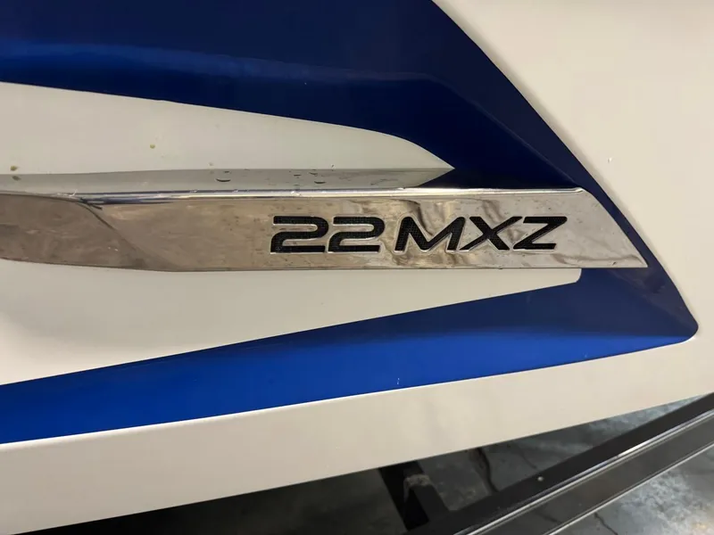 Slide: The Image of 2015 Malibu Wakesetter 22 MXZ emblem on boat hull. - 22