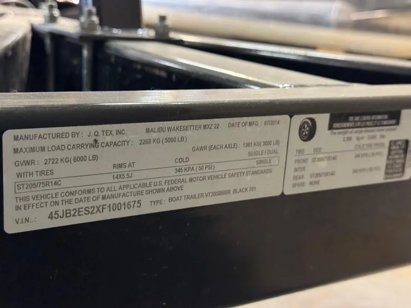 Slide: The Image of Label on 2015 Malibu Wakesetter 22 MXZ trailer showing specifications and VIN. - 28