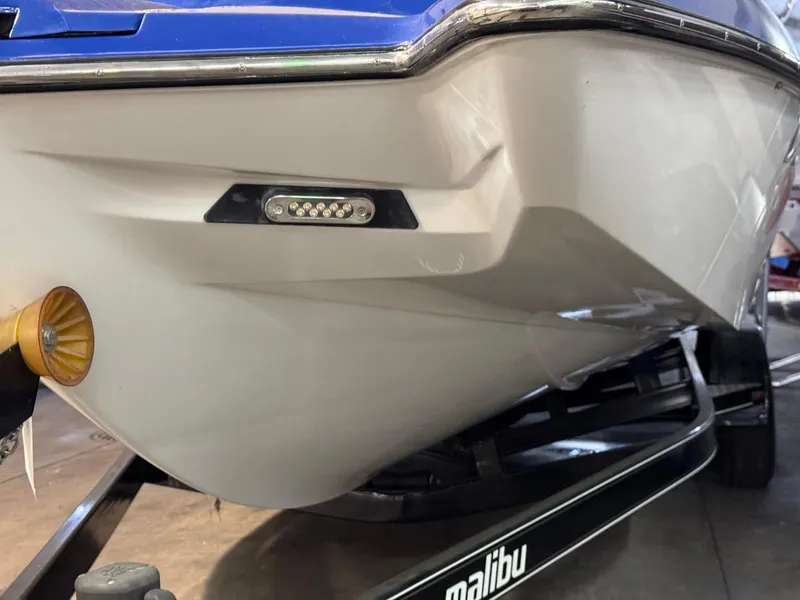 Slide: The Image of 2015 Malibu Wakesetter 22 MXZ boat hull with LED light detail. - 29