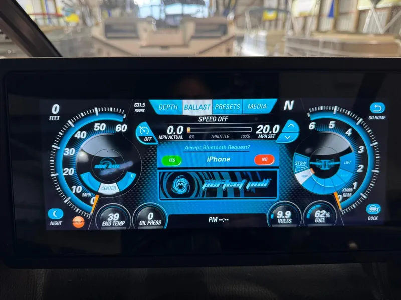 Slide: The Image of Dashboard of a 2015 Malibu Wakesetter 22 MXZ boat with digital controls and gauges. - 34